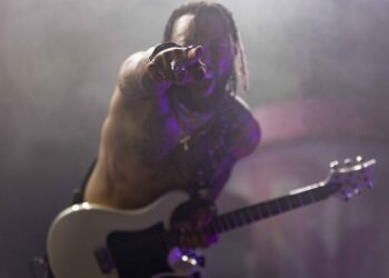 Machine Gun Kelly guitarist and Lone Sound podcast guest Justin Lyons performing in Dallas.